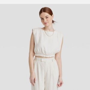 NWT Women's Slim Fit Extended Shoulder
Gauze Tank Top Cream A New Day